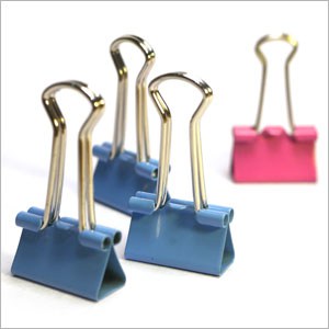 Binder clips: three blue and one pink, with their handles upright symbolizing the hostile work environment in California - Levian Law